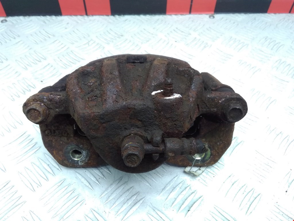 Суппорт передний левый KIA Carens 1999-2002