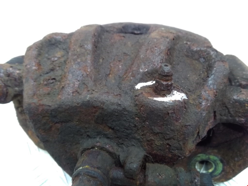 Суппорт передний левый KIA Carens 1999-2002