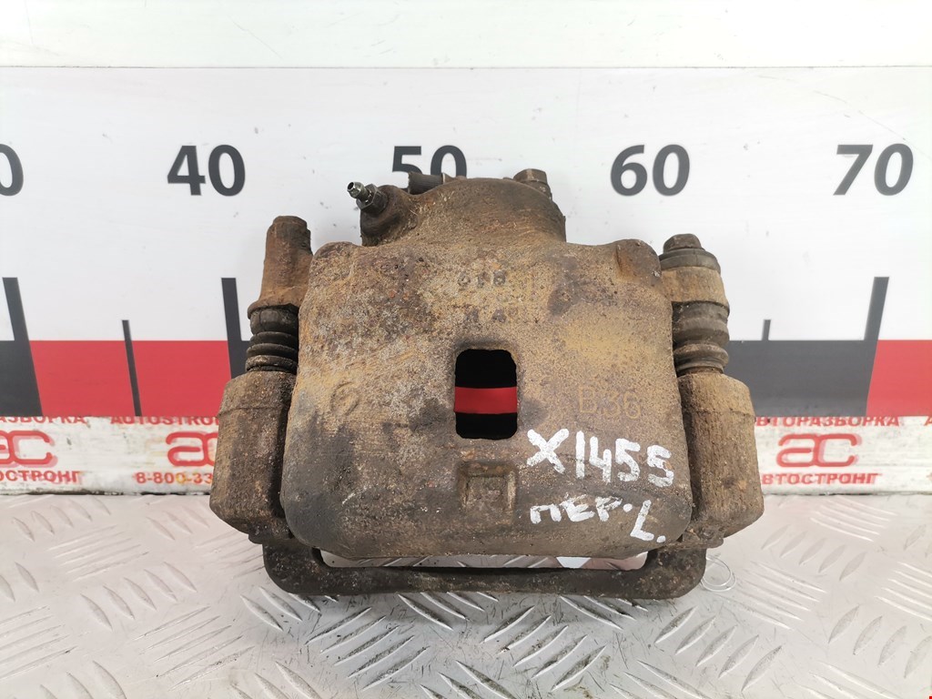 Суппорт передний левый SUBARU Legacy 1994-1999