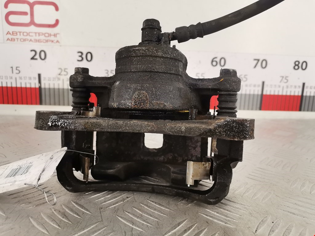 Суппорт передний правый SUZUKI Swift 1989-2003