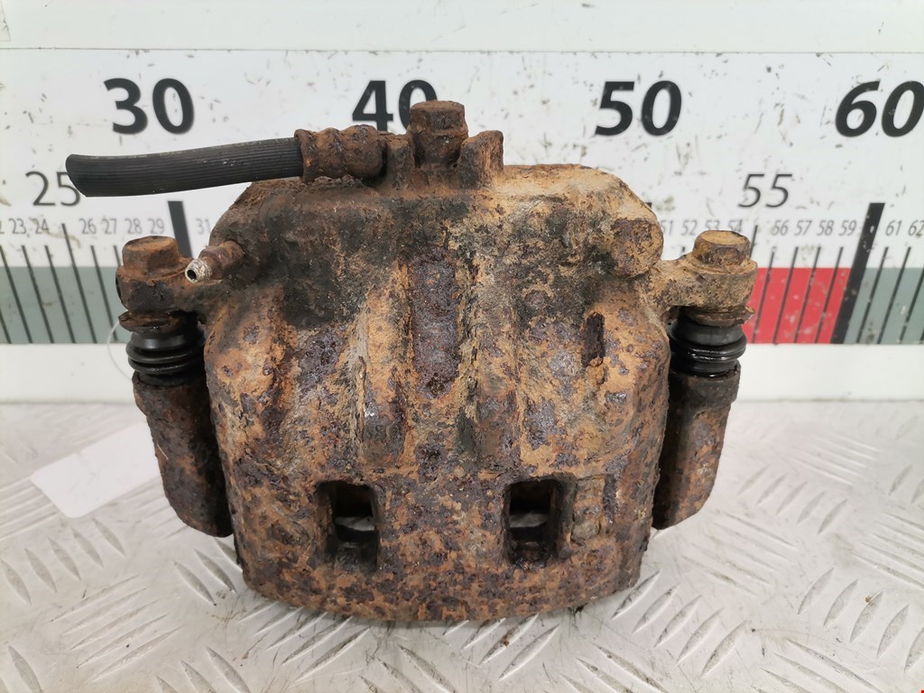 Суппорт передний левый SUBARU Forester I 1997-2002