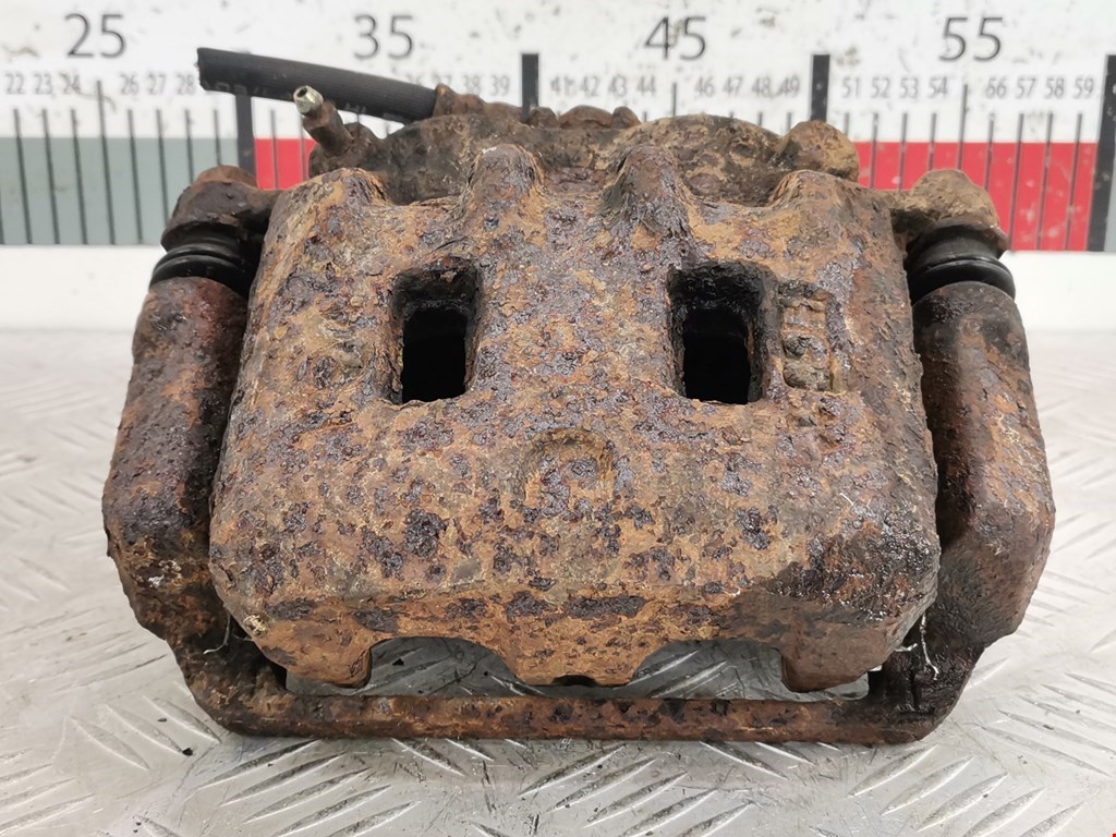 Суппорт передний левый SUBARU Forester I 1997-2002