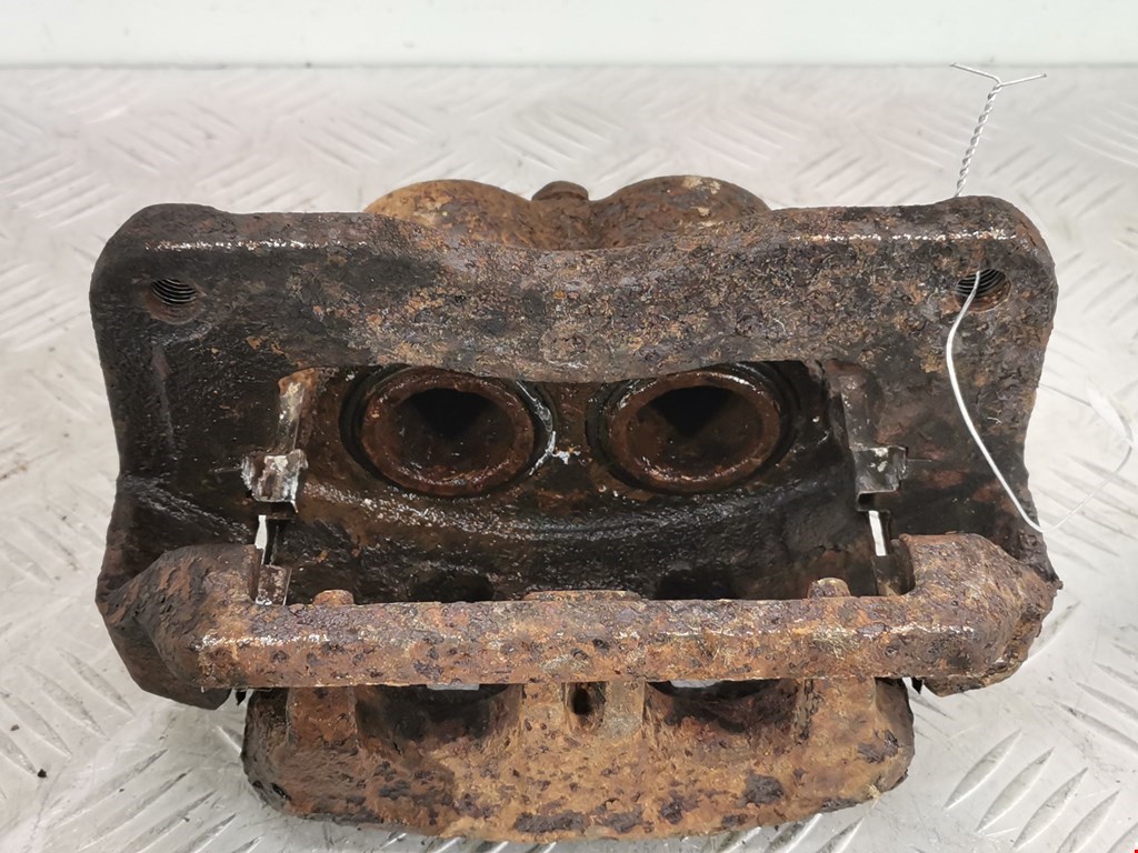 Суппорт передний левый SUBARU Forester I 1997-2002