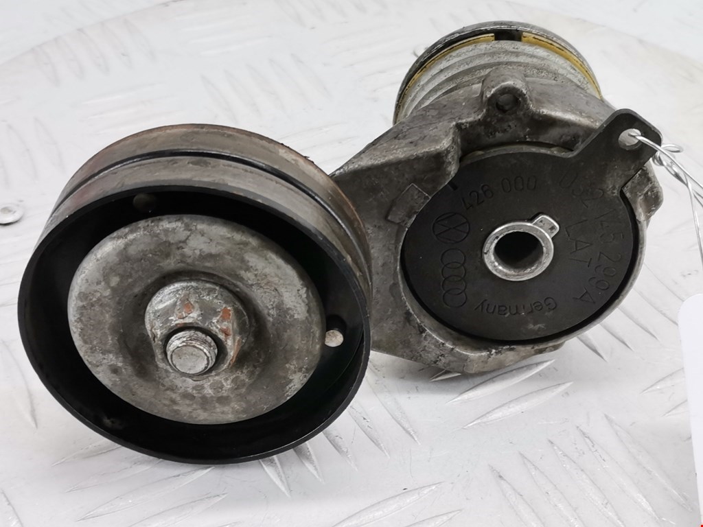 Натяжитель ремня генератора (приводного поликлинового ремня Volkswagen Golf 4 (1997-2004)