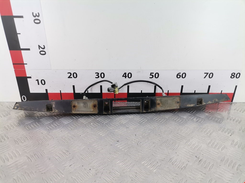 Фонарь подсветки номера KIA Carens 1999-2002