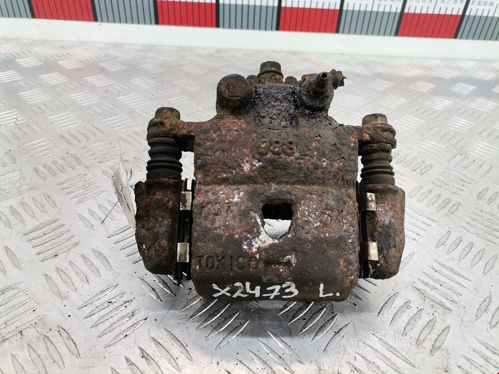 Суппорт передний левый SUZUKI Baleno 1995-2002