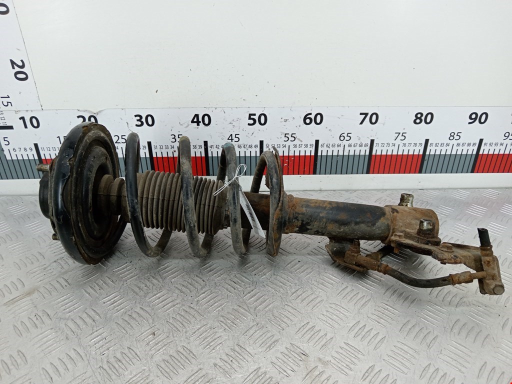 Стойка амортизатора переднего левого Nissan Primera P12 (2001-2008)