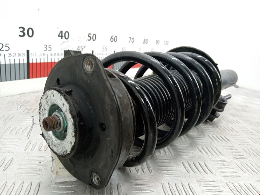 Амортизатор передний левый VOLKSWAGEN Passat B7 2011-2015