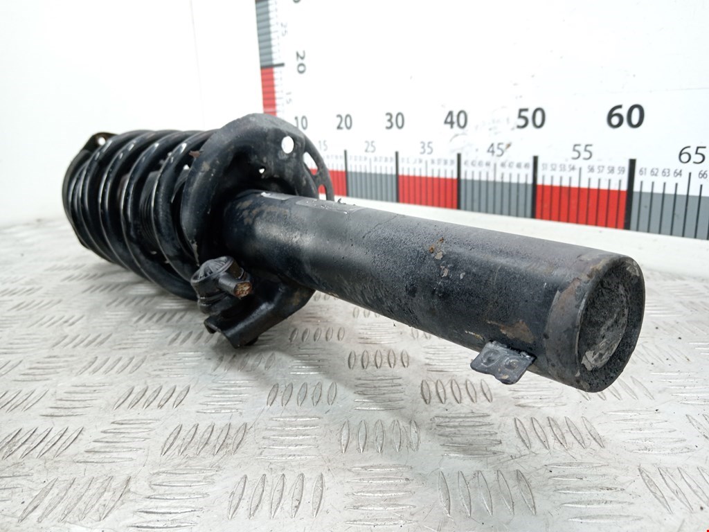 Амортизатор передний левый VOLKSWAGEN Passat B7 2011-2015