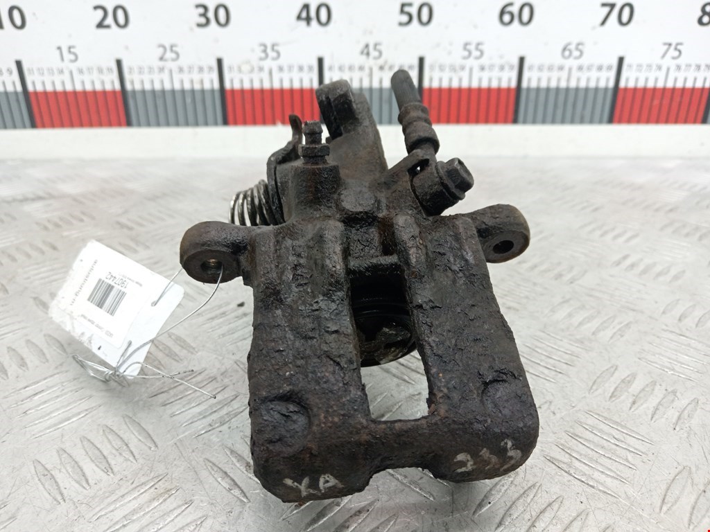 Суппорт задний левый Nissan Almera N16 (2000-2006)