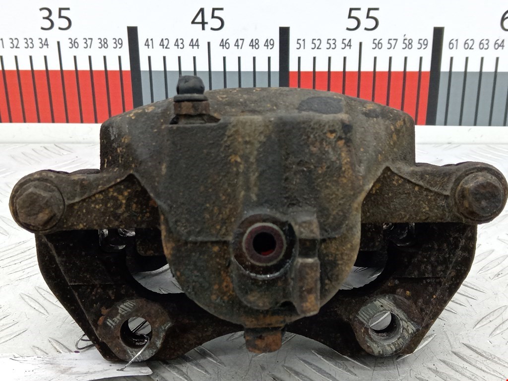 Суппорт передний левый NISSAN Primera P11 1996-2002