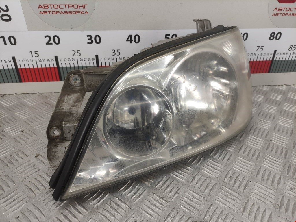 Фара левая KIA Carnival I 1999-2005
