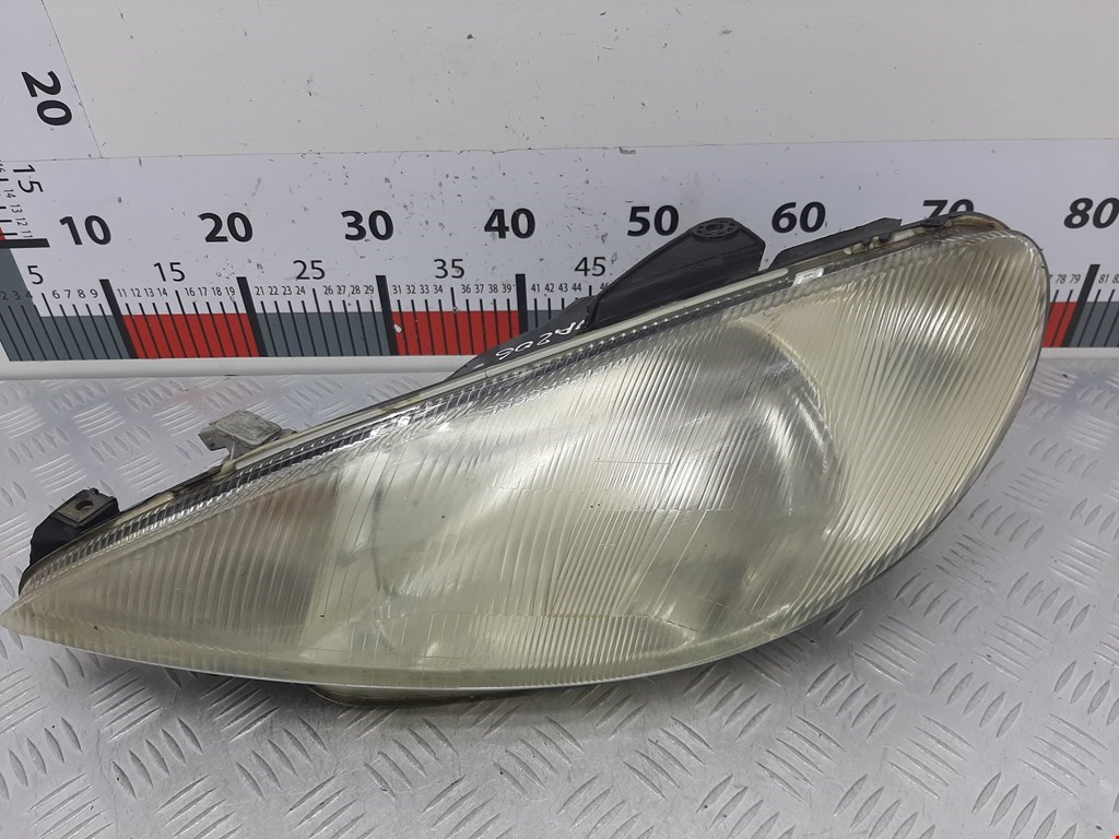 Фара левая Peugeot 206 (1998-2006)