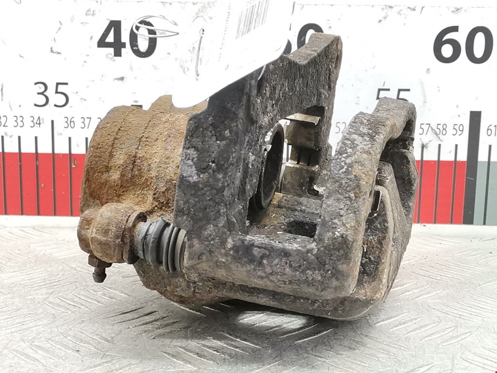 Суппорт передний левый SUBARU Forester II 2002-2008