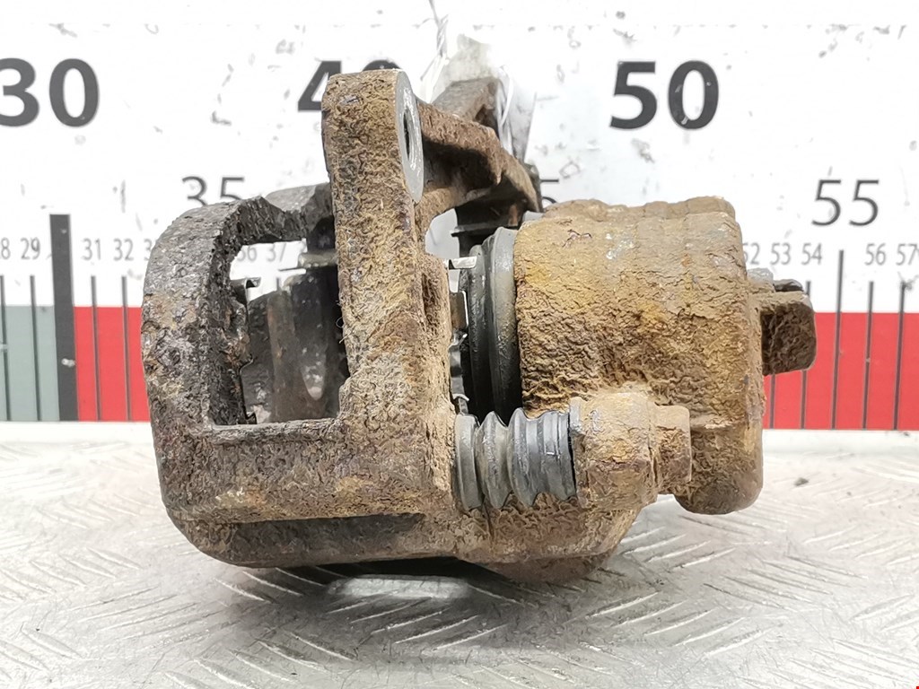 Суппорт передний левый SUBARU Forester II 2002-2008