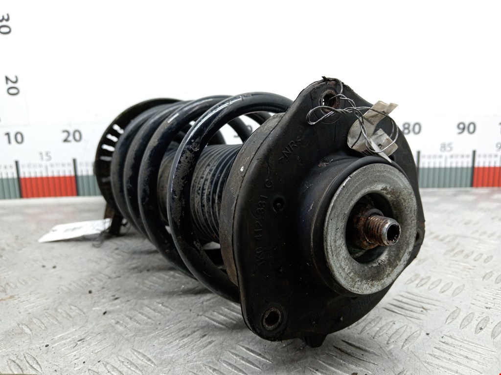 Амортизатор передний левый VOLKSWAGEN Passat B6 2005-2011