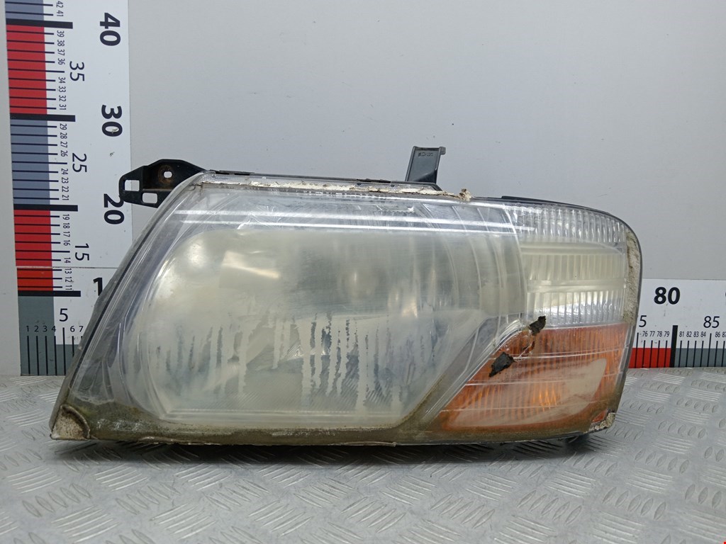 Фара левая MITSUBISHI Pajero III 2000-2006