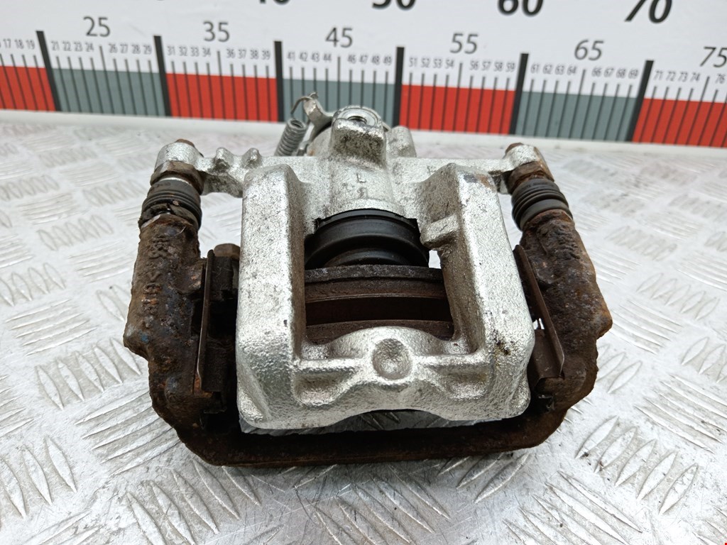 Суппорт задний левый Chevrolet Cruze 2 (J300) (2008-2016)