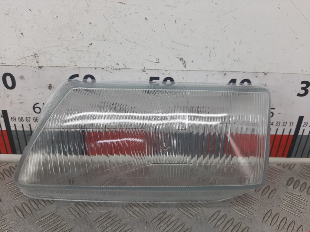 Стекло фары левой Opel Astra F (1991-1999)